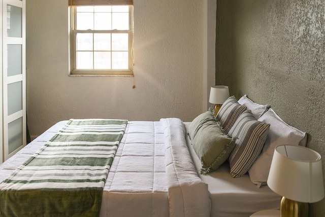 bedroom with a textured wall