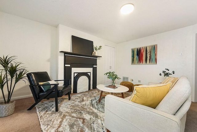 living room with visible vents, a fireplace, baseboards, and carpet