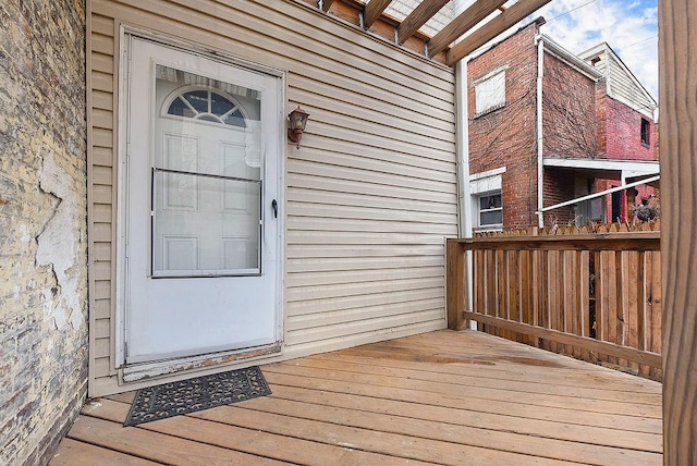 property entrance with a deck