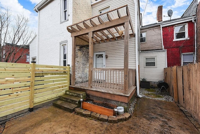 deck featuring a pergola and fence