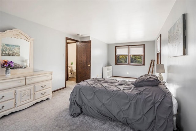 bedroom with light colored carpet, connected bathroom, radiator heating unit, and baseboards