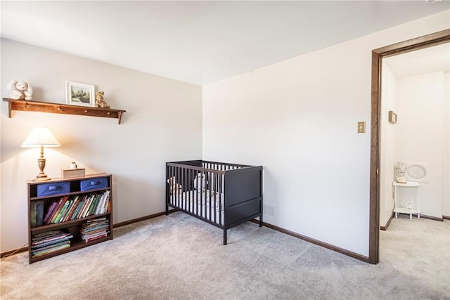 carpeted bedroom featuring baseboards