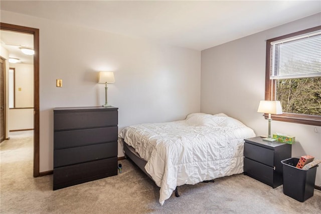 carpeted bedroom with baseboards