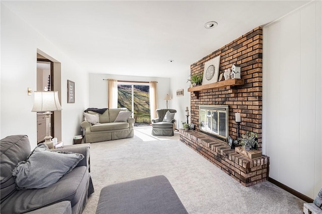 carpeted living room with a brick fireplace and baseboards