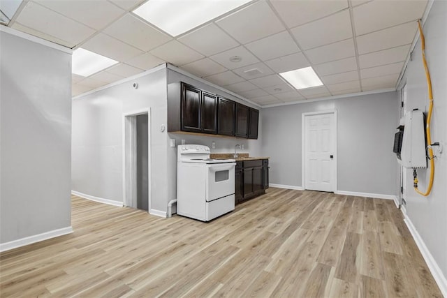 kitchen with a sink, light wood-type flooring, dark brown cabinetry, and white electric range oven