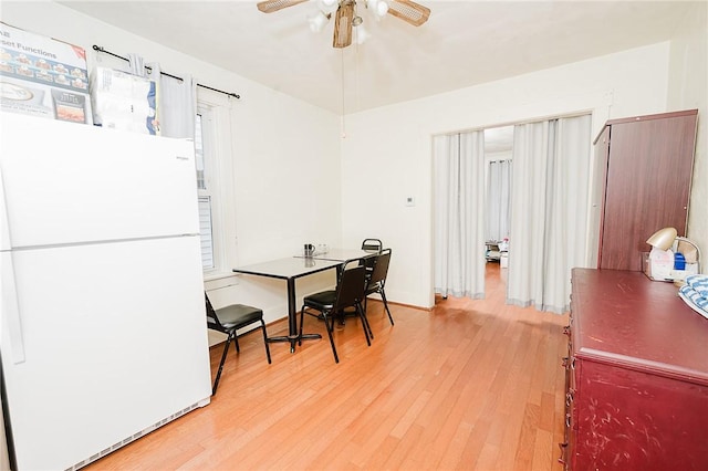 dining room with light wood-style floors and ceiling fan