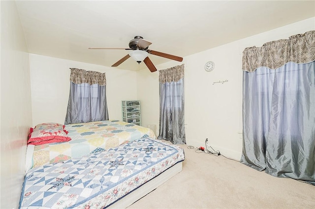 carpeted bedroom with a ceiling fan