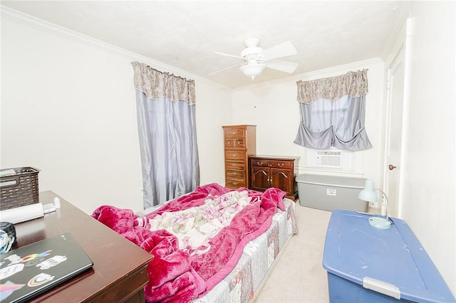 bedroom with ceiling fan, carpet flooring, and crown molding