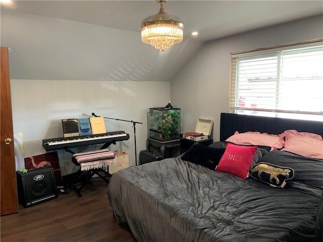 bedroom featuring an inviting chandelier, lofted ceiling, recessed lighting, and wood finished floors
