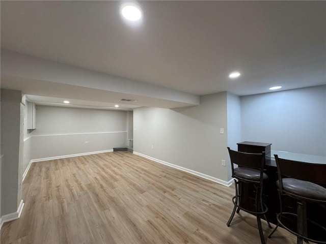 bar featuring recessed lighting, visible vents, baseboards, and wood finished floors