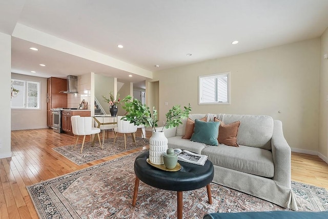 living area featuring recessed lighting and light wood-style floors