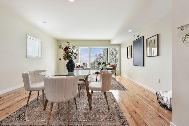 dining area featuring recessed lighting, baseboards, and light wood-style floors