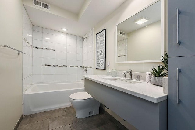 bathroom featuring toilet, tile patterned floors, shower / bathing tub combination, and visible vents