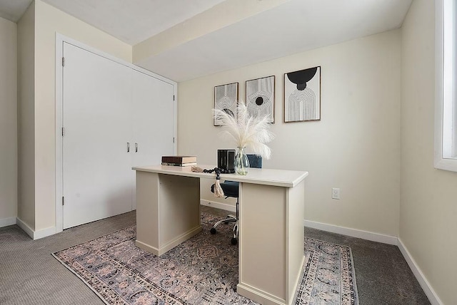 carpeted office with baseboards