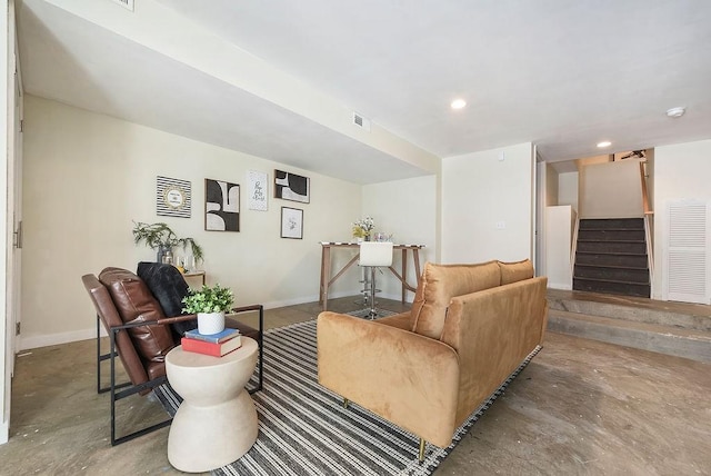 living room featuring baseboards, visible vents, concrete floors, recessed lighting, and stairs