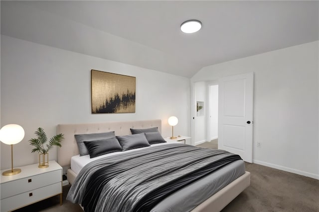 carpeted bedroom featuring baseboards and lofted ceiling