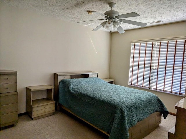 bedroom featuring multiple windows, visible vents, and carpet floors