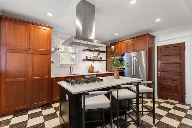 kitchen featuring island exhaust hood, light floors, light countertops, and a sink