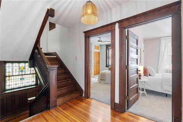 stairs featuring baseboards and wood finished floors