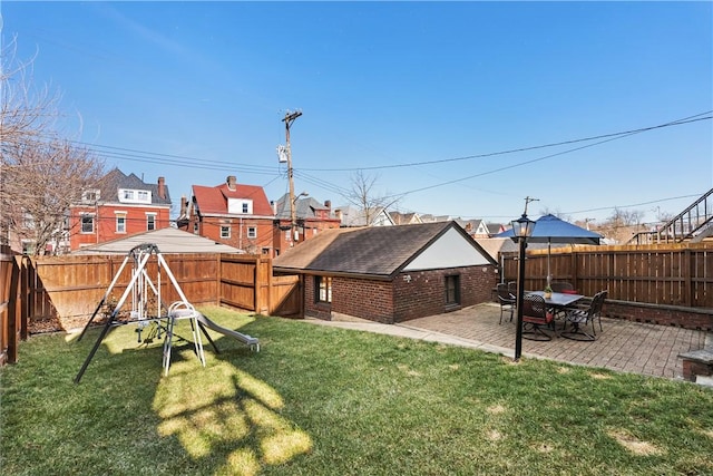 view of yard with a fenced backyard and a patio