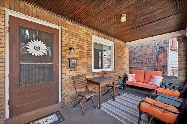 exterior space featuring a porch and an outdoor hangout area