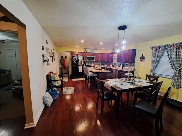 dining area with recessed lighting, baseboards, a textured ceiling, and dark wood-style flooring