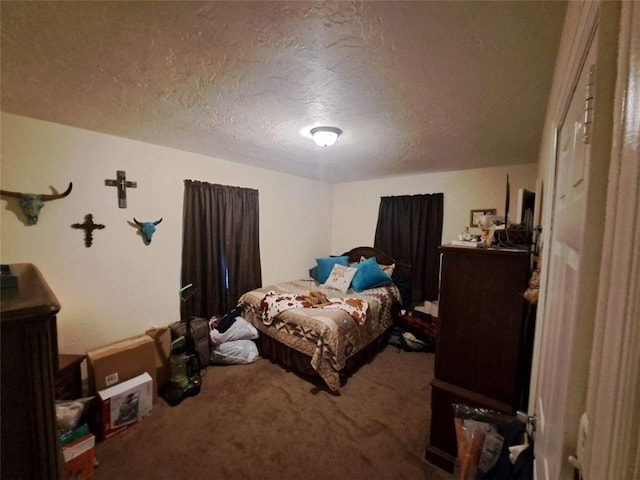 carpeted bedroom with a textured ceiling