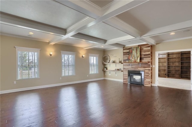 unfurnished living room featuring a tiled fireplace, beamed ceiling, dark wood-style floors, and coffered ceiling