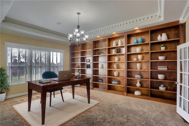 office with a tray ceiling, built in features, baseboards, and a chandelier