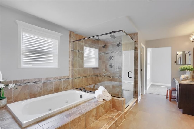 bathroom with vanity, a whirlpool tub, and a shower stall