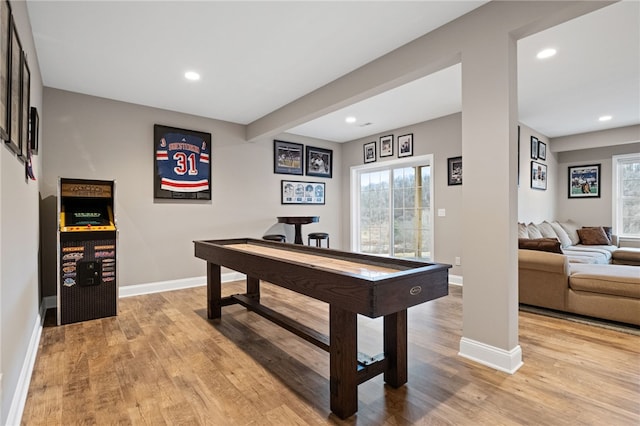 recreation room featuring recessed lighting, baseboards, and light wood-style flooring