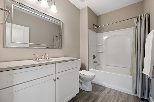 full bath featuring toilet, shower / bathtub combination with curtain, vanity, and wood finished floors