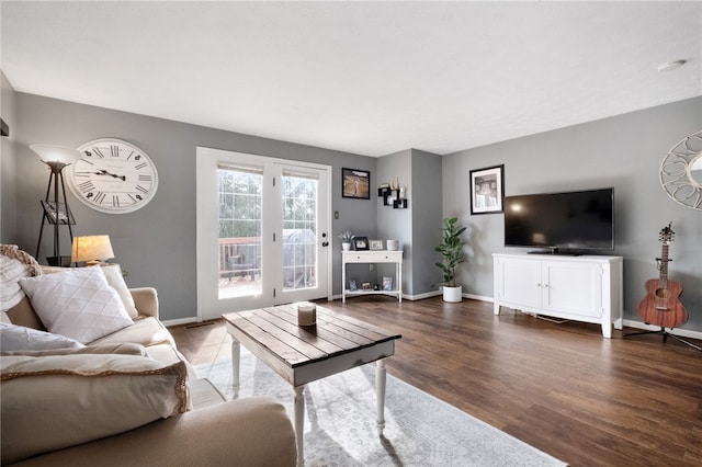 living room with wood finished floors and baseboards