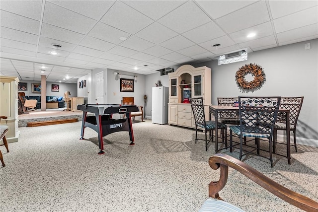 game room with recessed lighting, a paneled ceiling, and baseboards