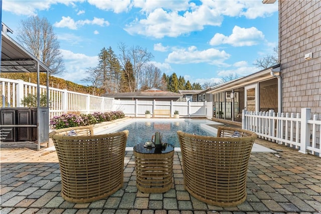 view of patio / terrace featuring a fenced backyard and a fenced in pool