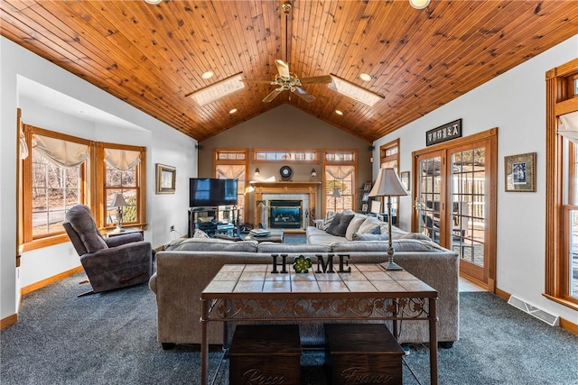 living room featuring visible vents, wood ceiling, dark colored carpet, and french doors