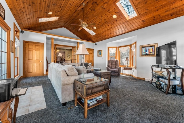 living area with lofted ceiling with skylight, baseboards, wood ceiling, and carpet