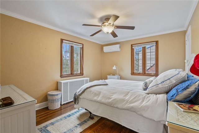 bedroom featuring multiple windows, an AC wall unit, wood finished floors, and radiator heating unit