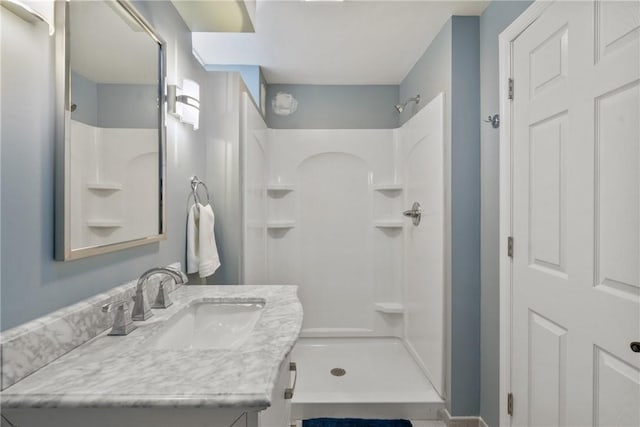 bathroom with vanity and walk in shower