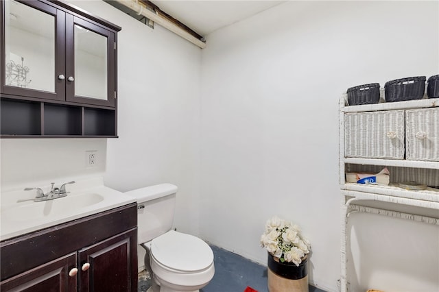 bathroom featuring toilet and vanity