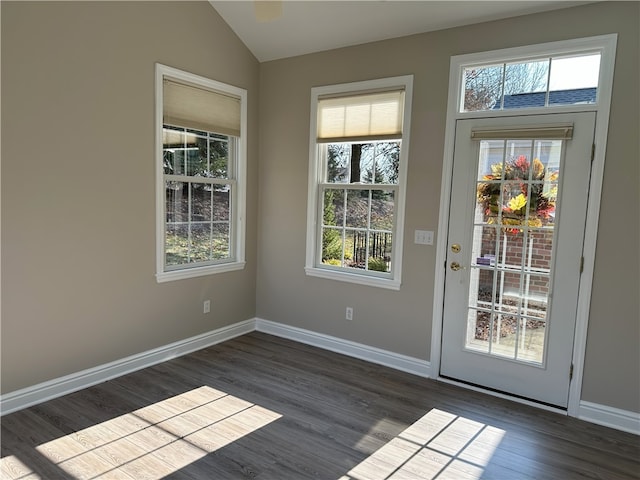 entryway featuring baseboards, dark wood-style flooring, and vaulted ceiling