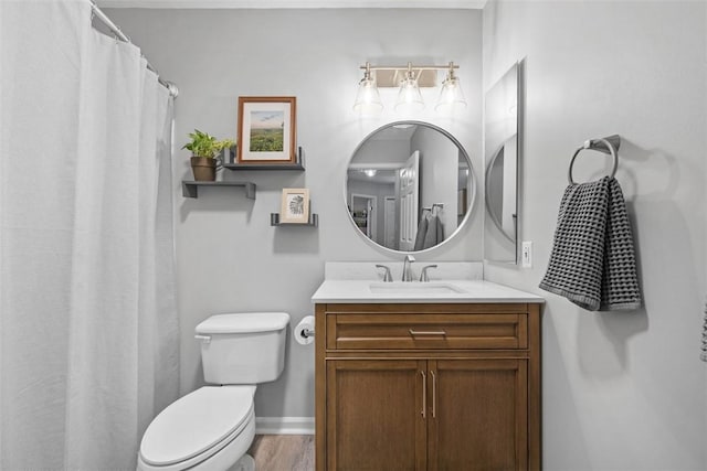 bathroom featuring curtained shower, baseboards, toilet, wood finished floors, and vanity