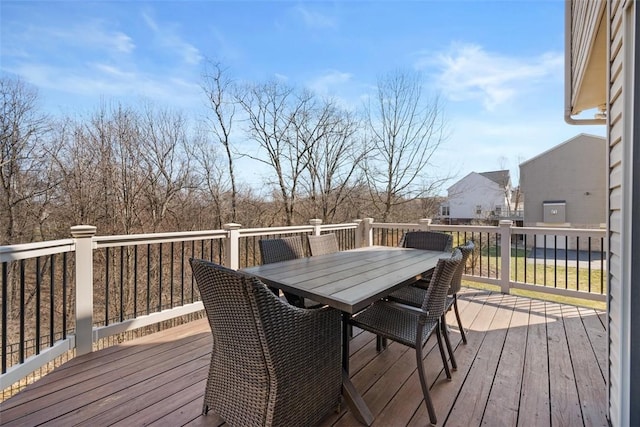 wooden terrace featuring outdoor dining space