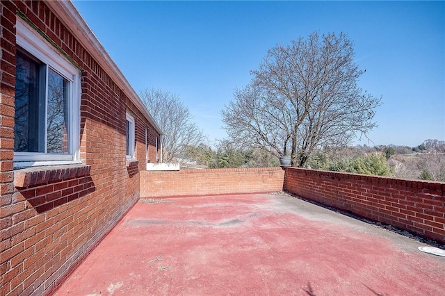 view of patio featuring fence