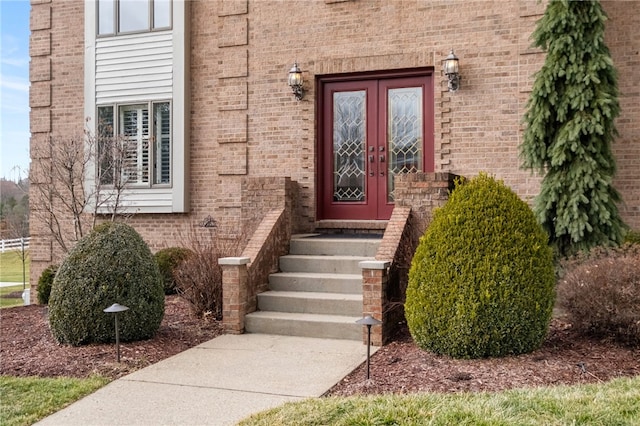 entrance to property with brick siding