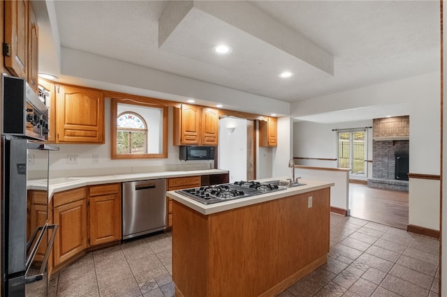 kitchen featuring plenty of natural light, recessed lighting, baseboards, and appliances with stainless steel finishes