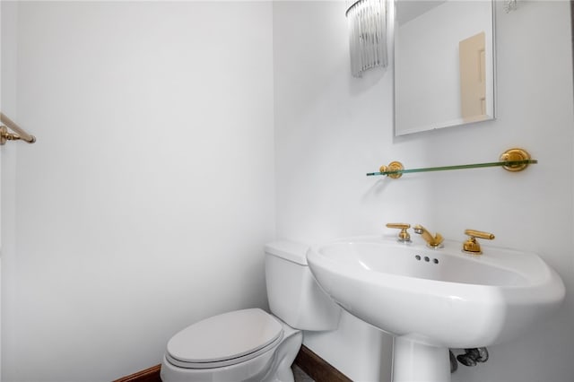 bathroom featuring toilet and a sink