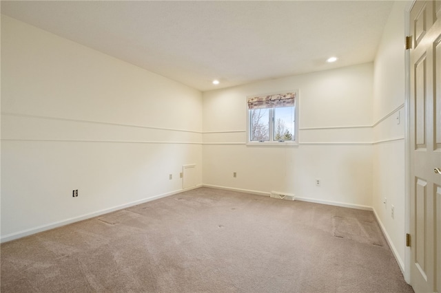 unfurnished room with recessed lighting, carpet, visible vents, and baseboards