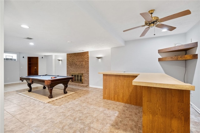 playroom with a brick fireplace, pool table, and baseboards