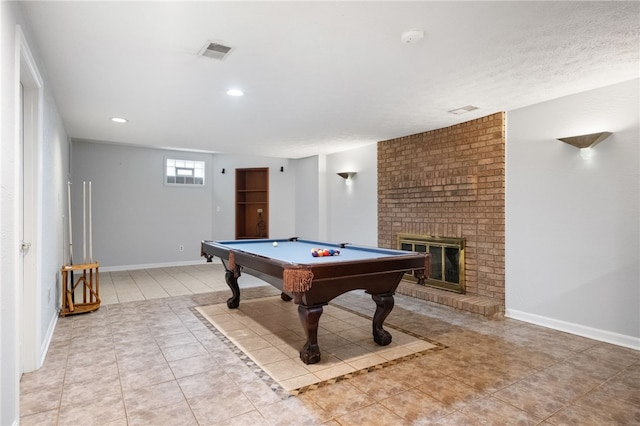 game room featuring visible vents, baseboards, a brick fireplace, and billiards